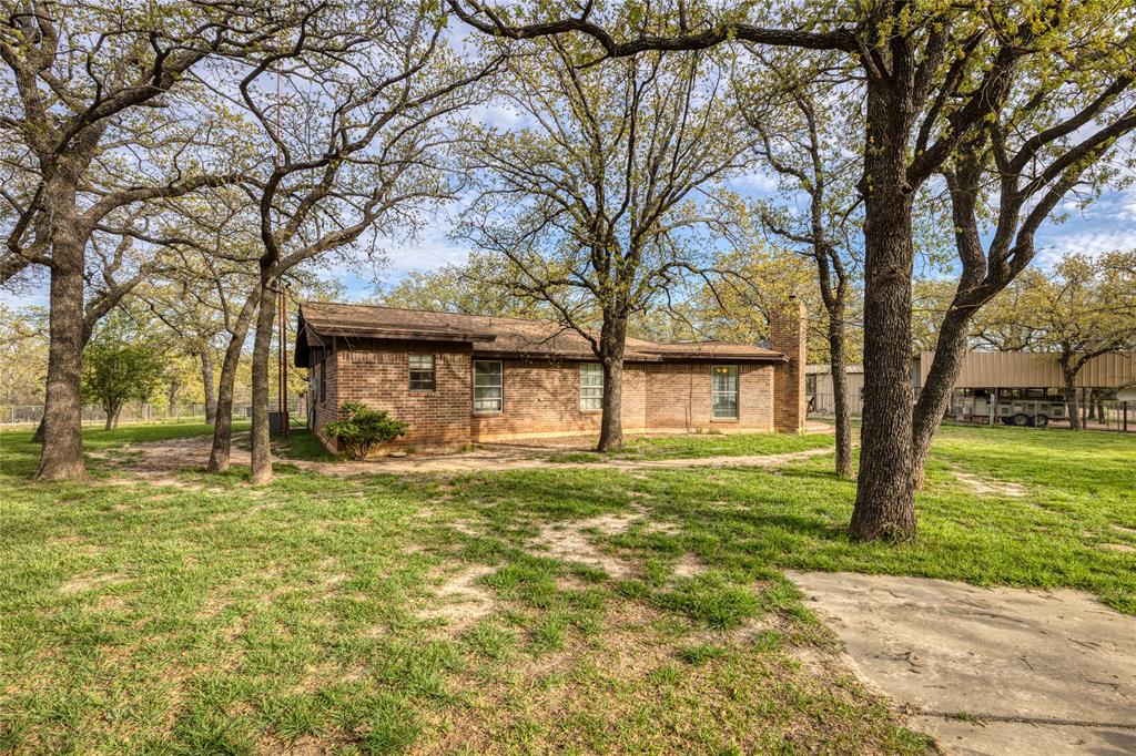 243 County Road 3851 Poolville, TX 76487 - Photo 27 of 34 a view of a house with a yard