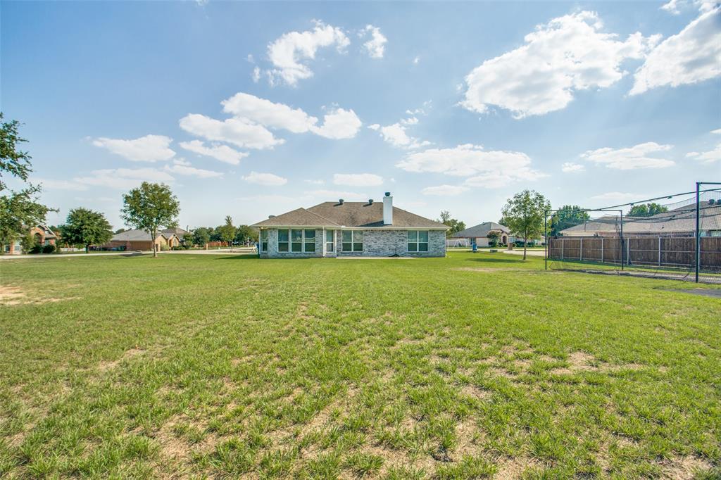 149 Shumard Drive Aledo, TX 76008 - Photo 11 of 12 a view of yard with swimming pool and green space