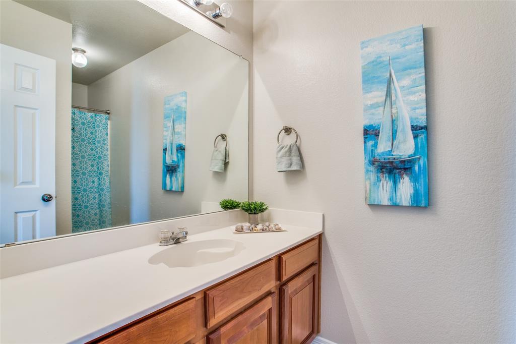149 Shumard Drive Aledo, TX 76008 - Photo 7 of 12 a bathroom with a sink and a mirror