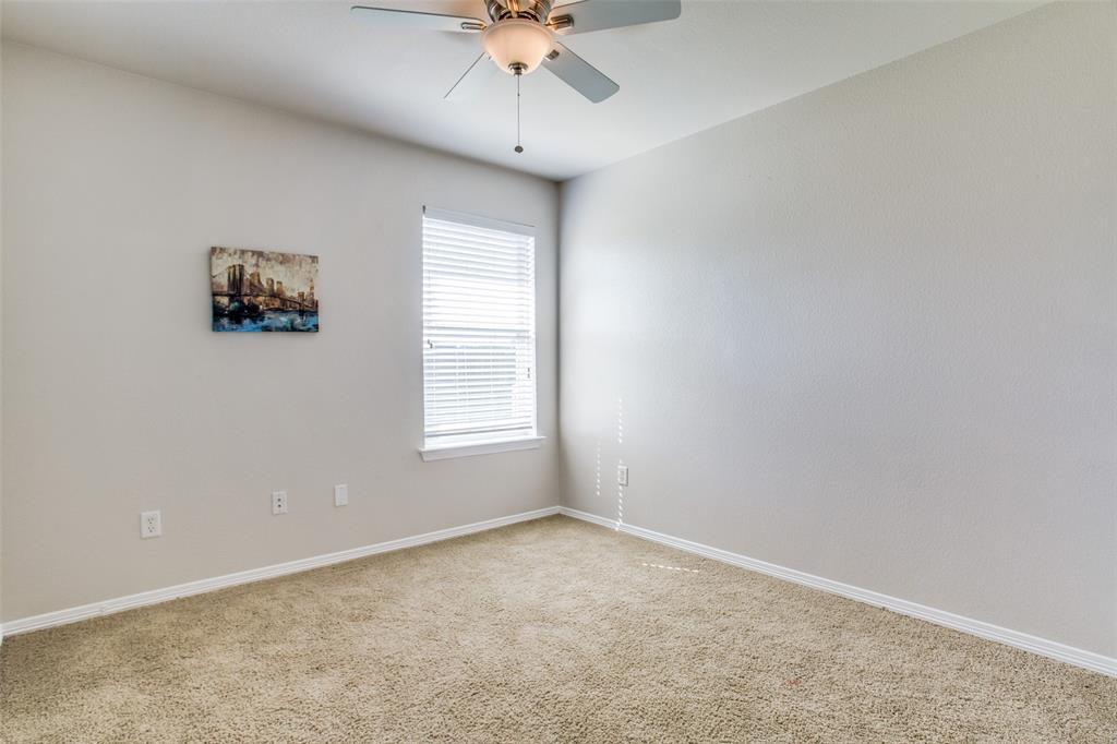 149 Shumard Drive Aledo, TX 76008 - Photo 8 of 12 an empty room with a window and a fan