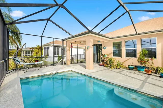 a view of a lake with houses in the back