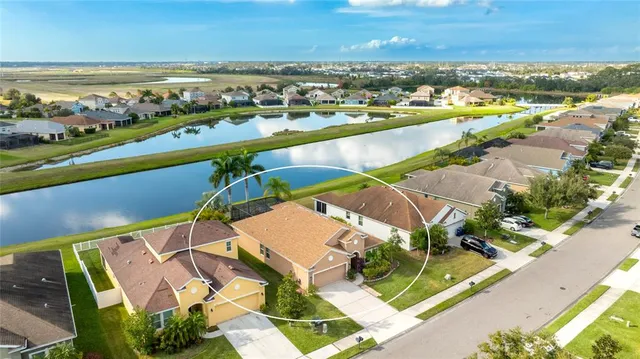 an aerial view of residential building and lake view