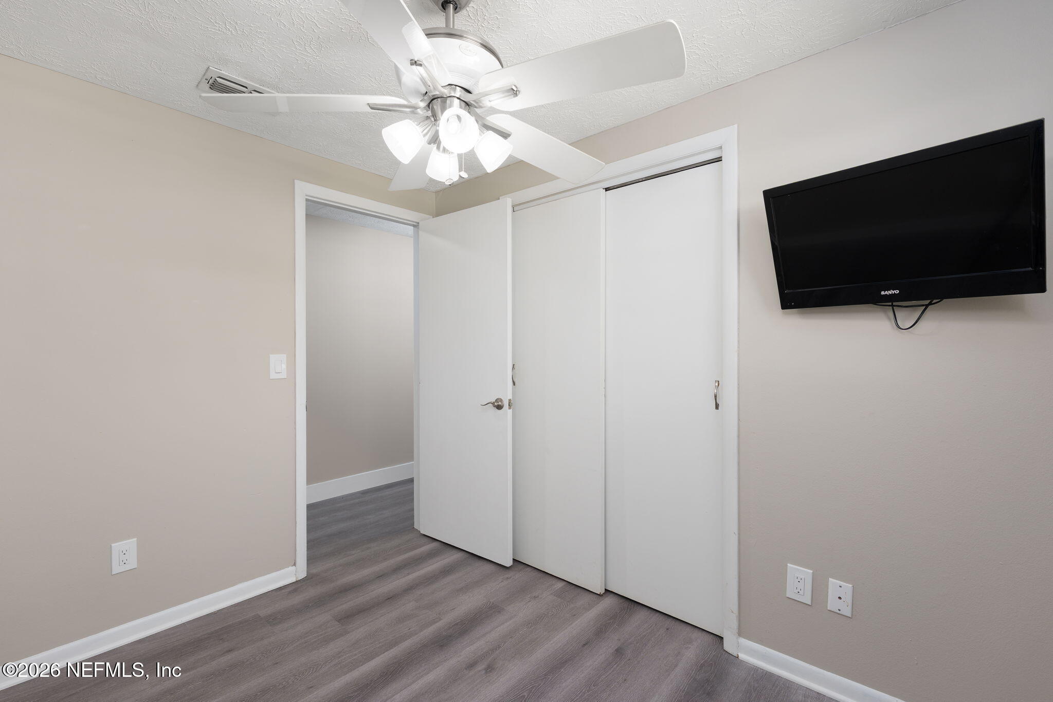 724 Miltondale Road Macclenny, FL 32063 - Photo 15 of 31 a view of a livingroom with a flat screen tv