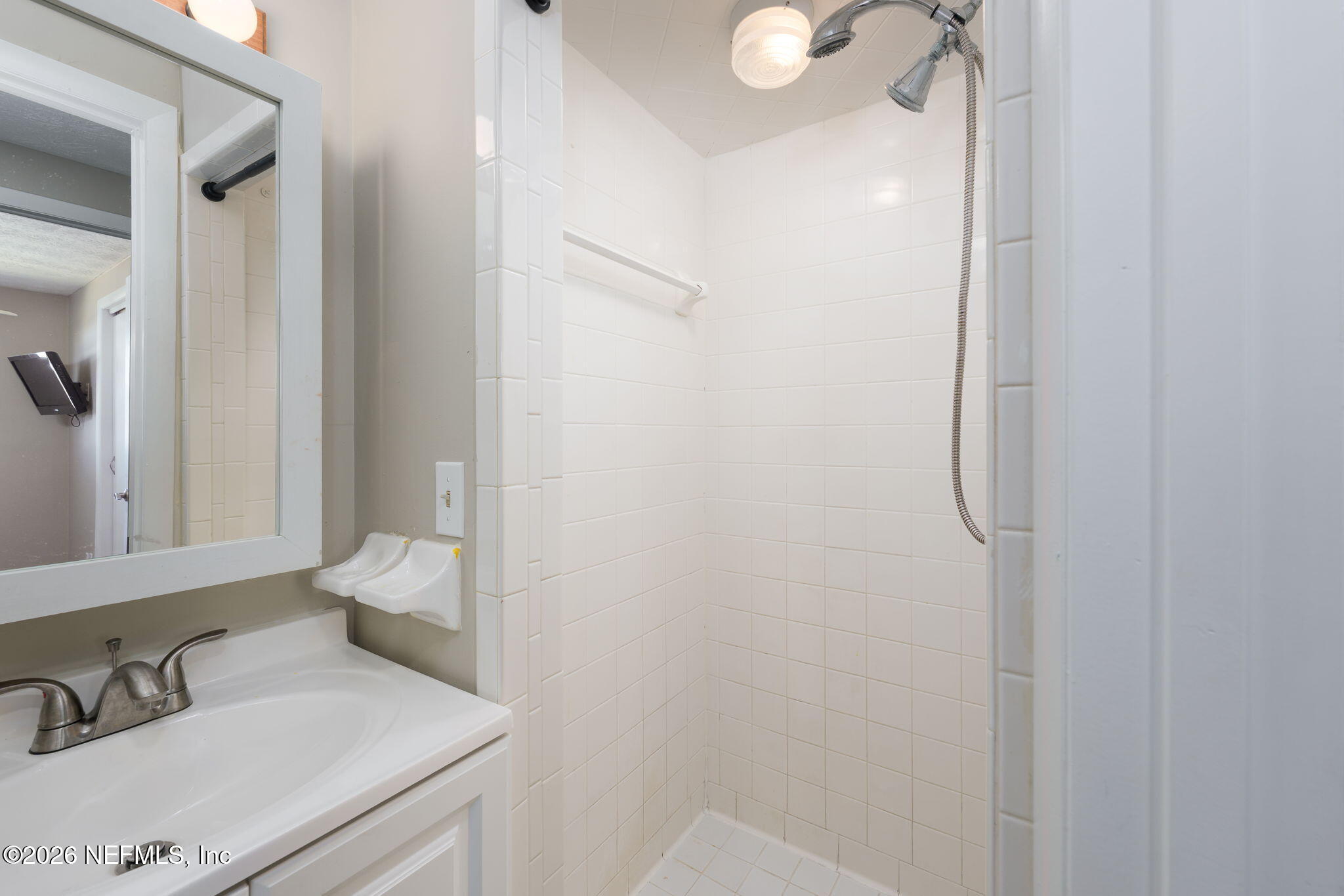 724 Miltondale Road Macclenny, FL 32063 - Photo 17 of 31 a bathroom with a sink and a mirror