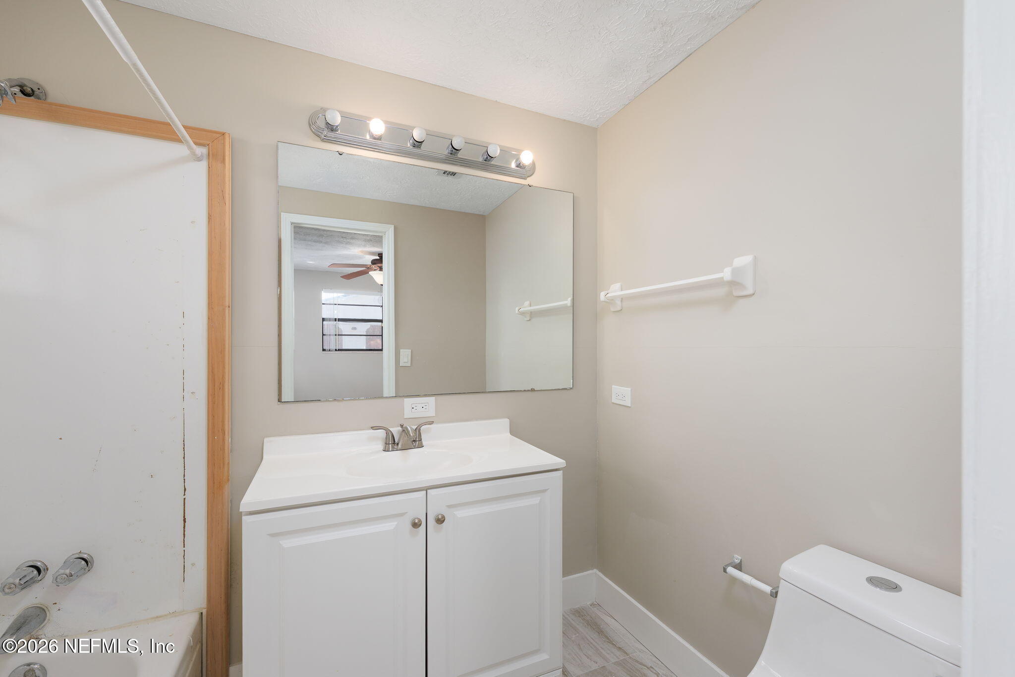724 Miltondale Road Macclenny, FL 32063 - Photo 20 of 31 a bathroom with a sink a toilet and mirror