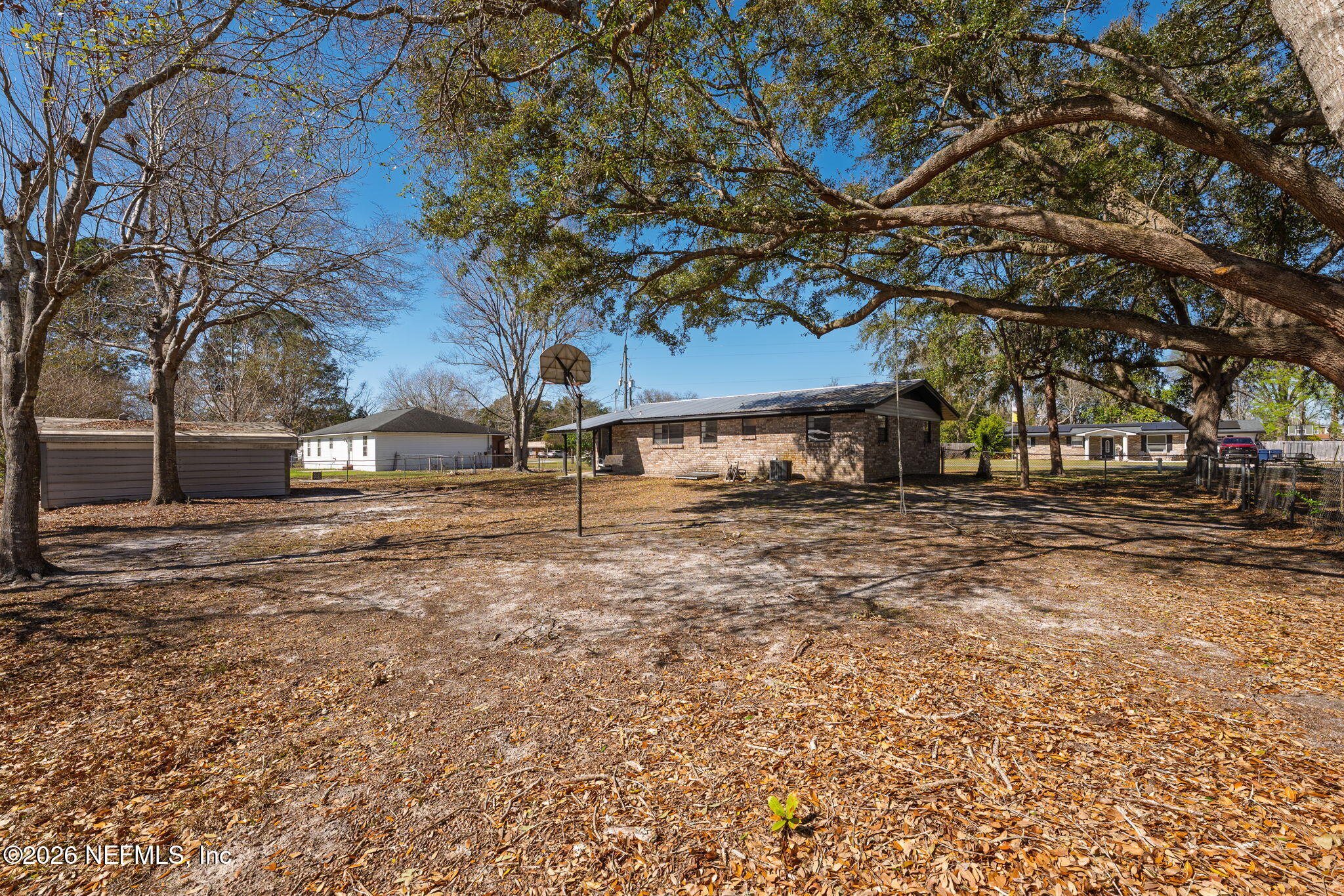 724 Miltondale Road Macclenny, FL 32063 - Photo 26 of 31 a view of outdoor space with deck and trees