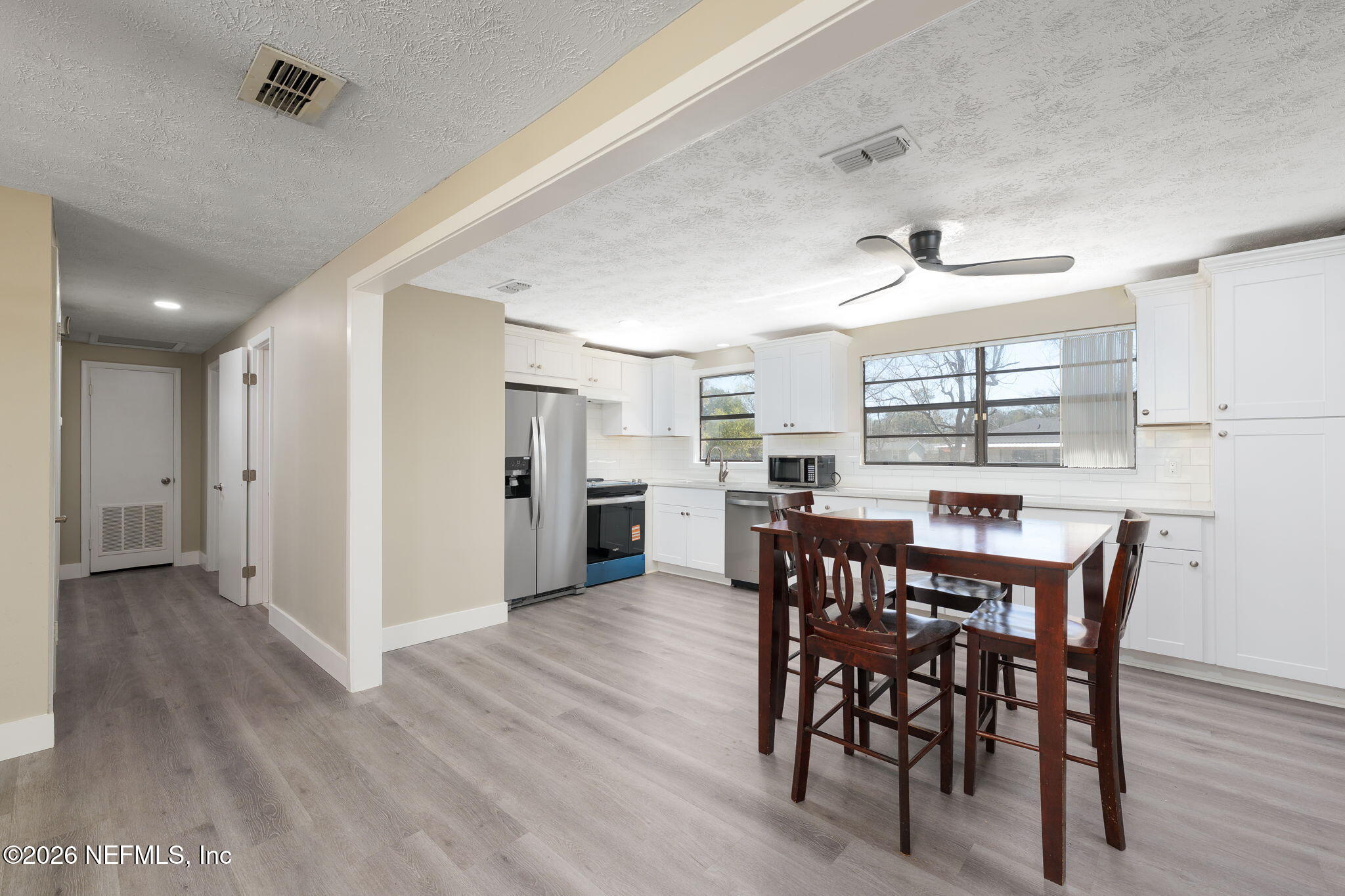 724 Miltondale Road Macclenny, FL 32063 - Photo 8 of 31 a view of a dining room with furniture and wooden floor