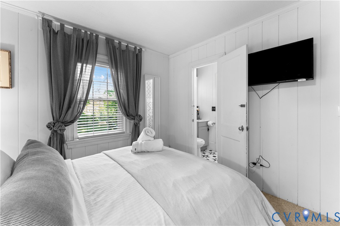 437 Plainview Road Kinsale, VA 22488 - Photo 40 of 63 a bedroom with a bed and a flat screen tv