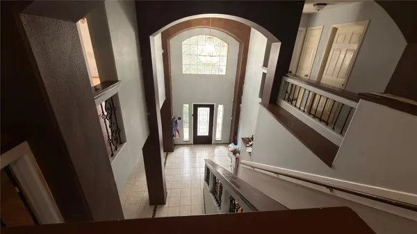 a view of an entryway with a mirror