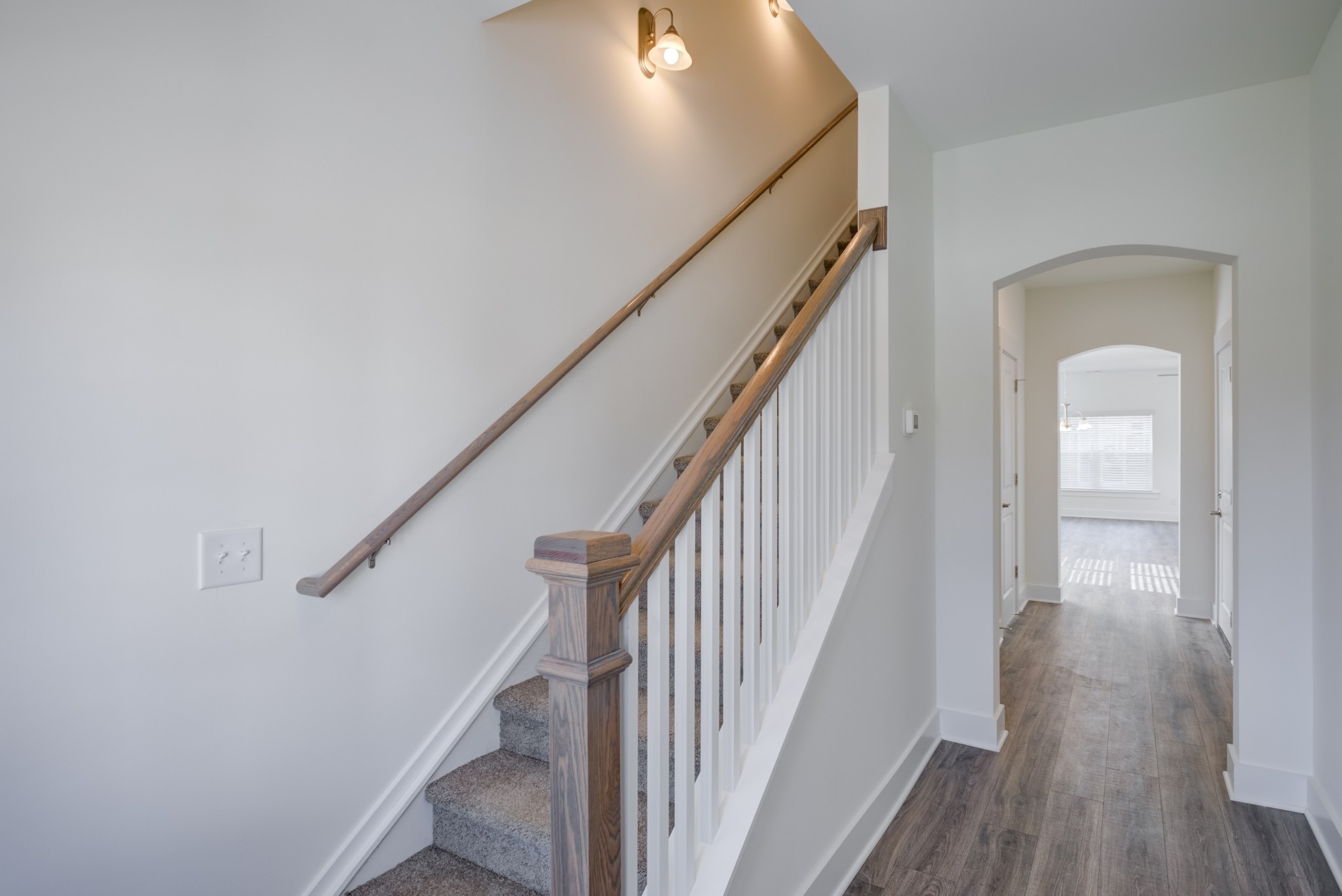 7030 Gracious Drive Franklin, TN 37064 - Photo 16 of 24 a view of staircase with wooden floor and white walls