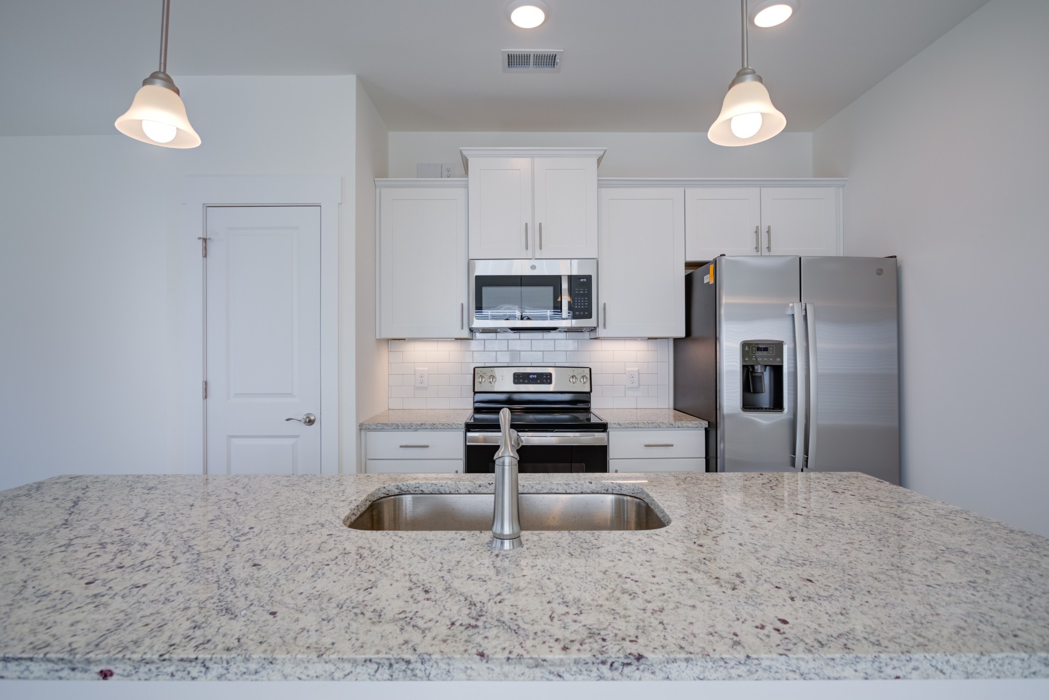 7030 Gracious Drive Franklin, TN 37064 - Photo 18 of 24 a kitchen with a refrigerator sink and stove