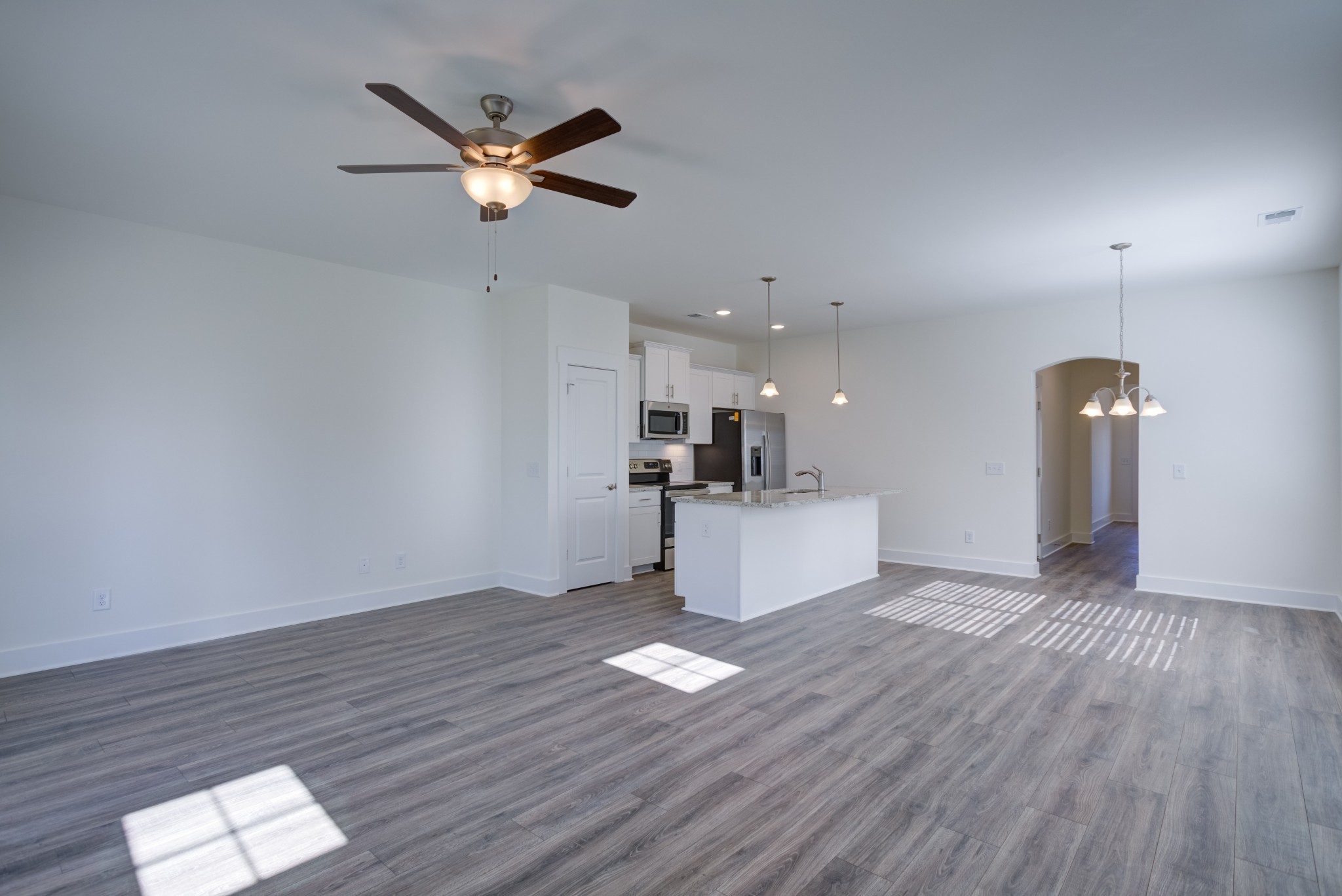 7030 Gracious Drive Franklin, TN 37064 - Photo 20 of 24 a living room with hard wood flooring and a ceiling fan