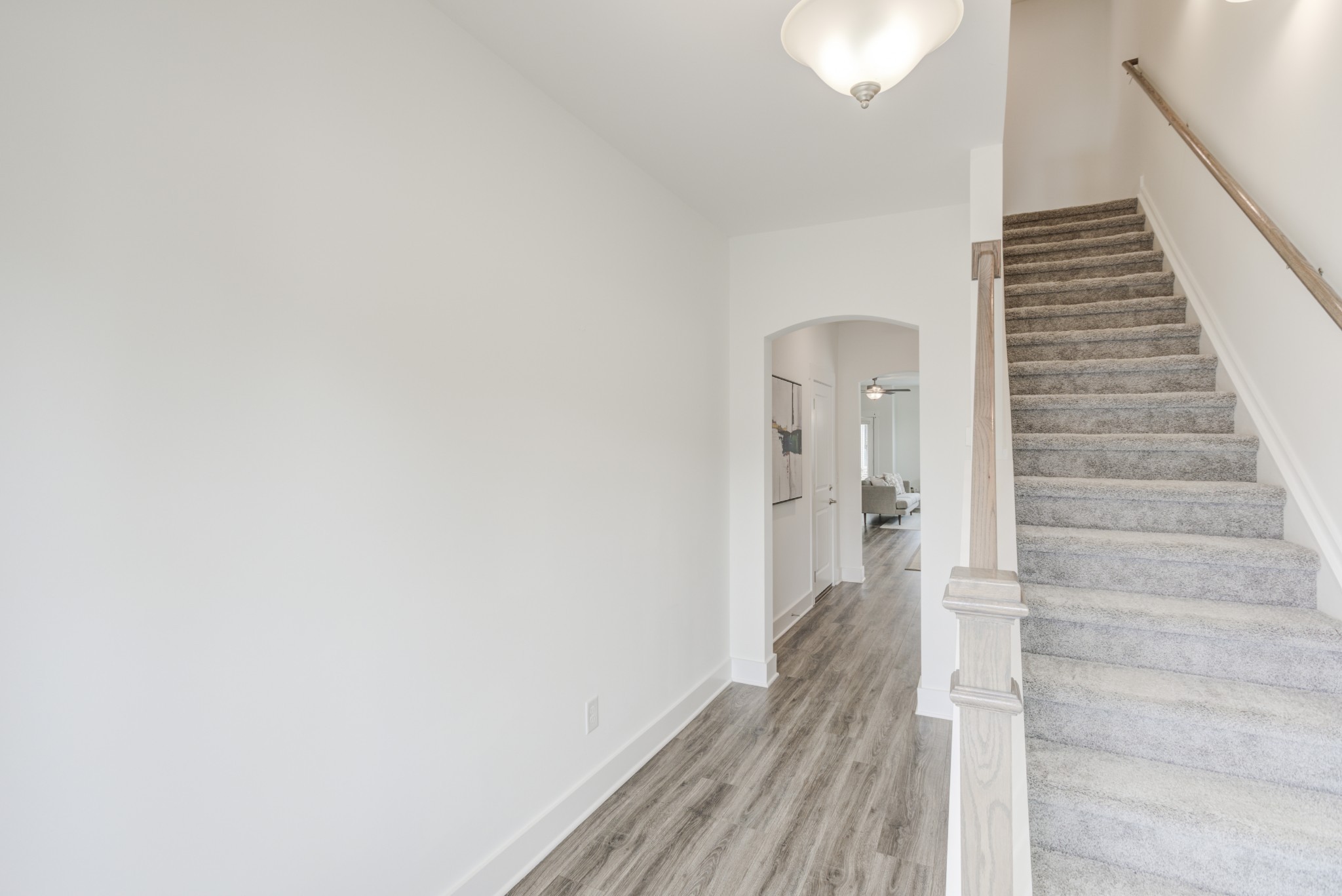 7030 Gracious Drive Franklin, TN 37064 - Photo 2 of 24 a view of a hallway with wooden floor and staircase