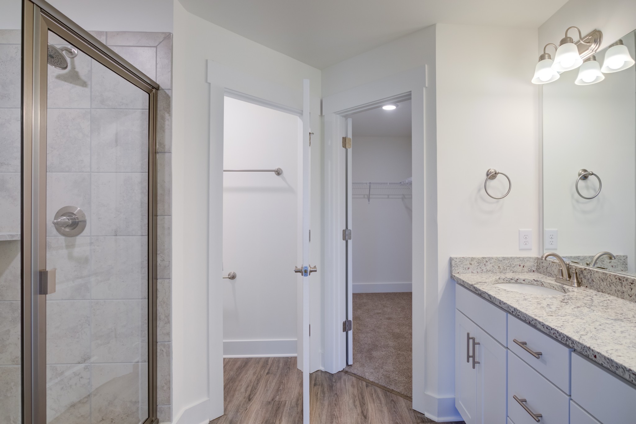 7030 Gracious Drive Franklin, TN 37064 - Photo 22 of 24 a bathroom with a granite countertop shower sink and mirror