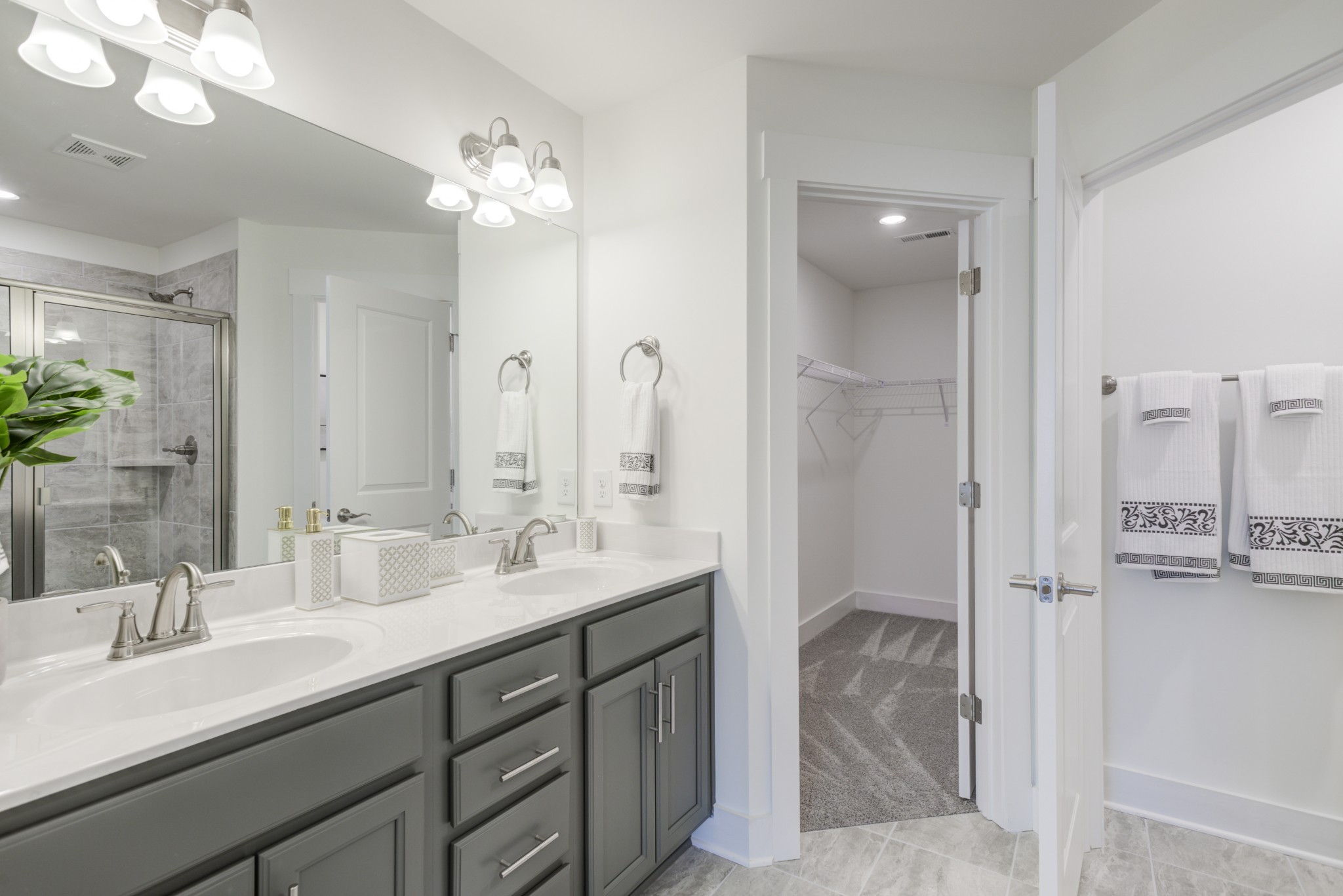 7030 Gracious Drive Franklin, TN 37064 - Photo 9 of 24 a bathroom with a double vanity sink and a mirror
