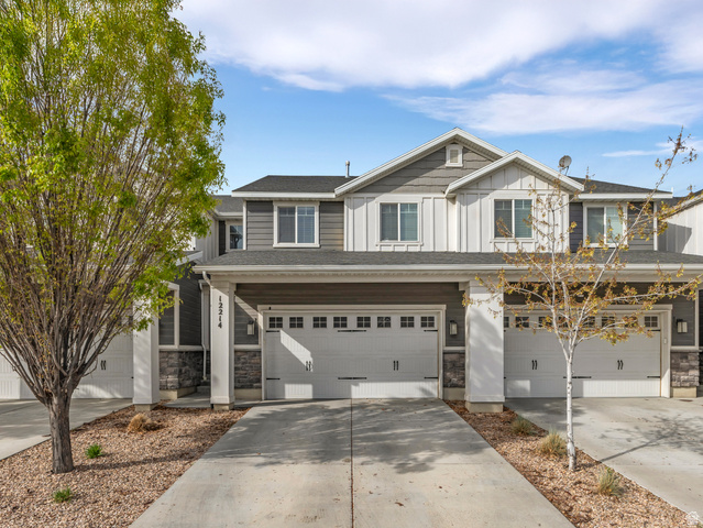 12214 Sunpark Lane Draper, UT 84020 - Photo 1 of 24 Craftsman inspired home featuring board and batten siding, concrete driveway, stone siding, and an attached garage