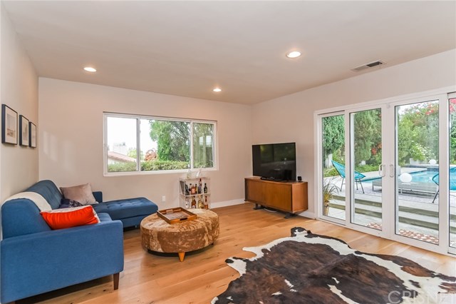 20153 Adele Drive Woodland Hills, CA 91364 - Photo 16 of 70 Family room - doors open out onto pool and yard