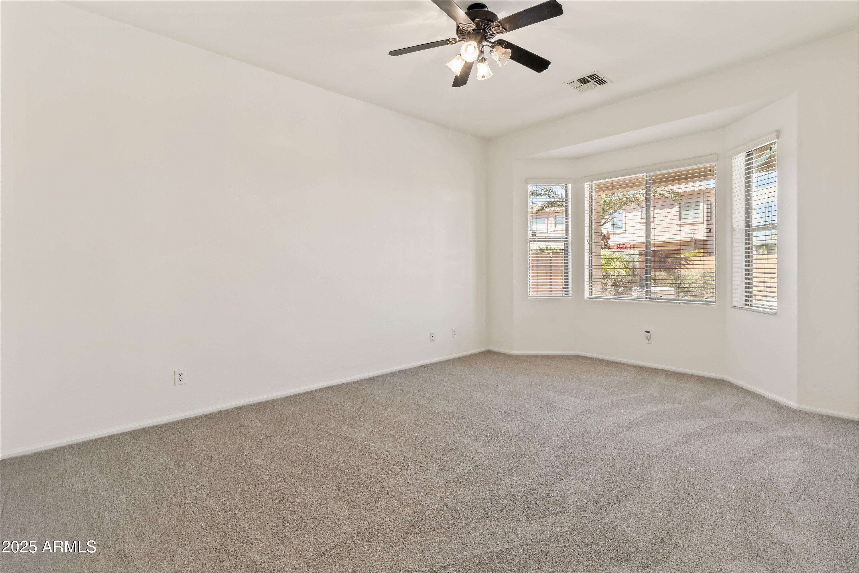 45076 West Rhea Road Maricopa, AZ 85139 - Photo 18 of 43 a view of an empty room with a window