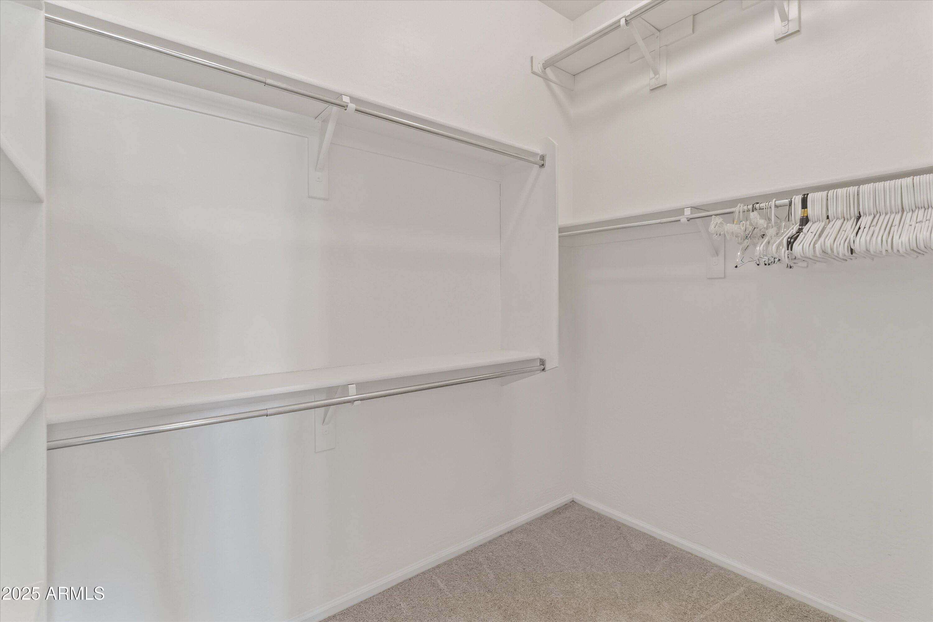 45076 West Rhea Road Maricopa, AZ 85139 - Photo 25 of 43 a view of an empty walk in closet