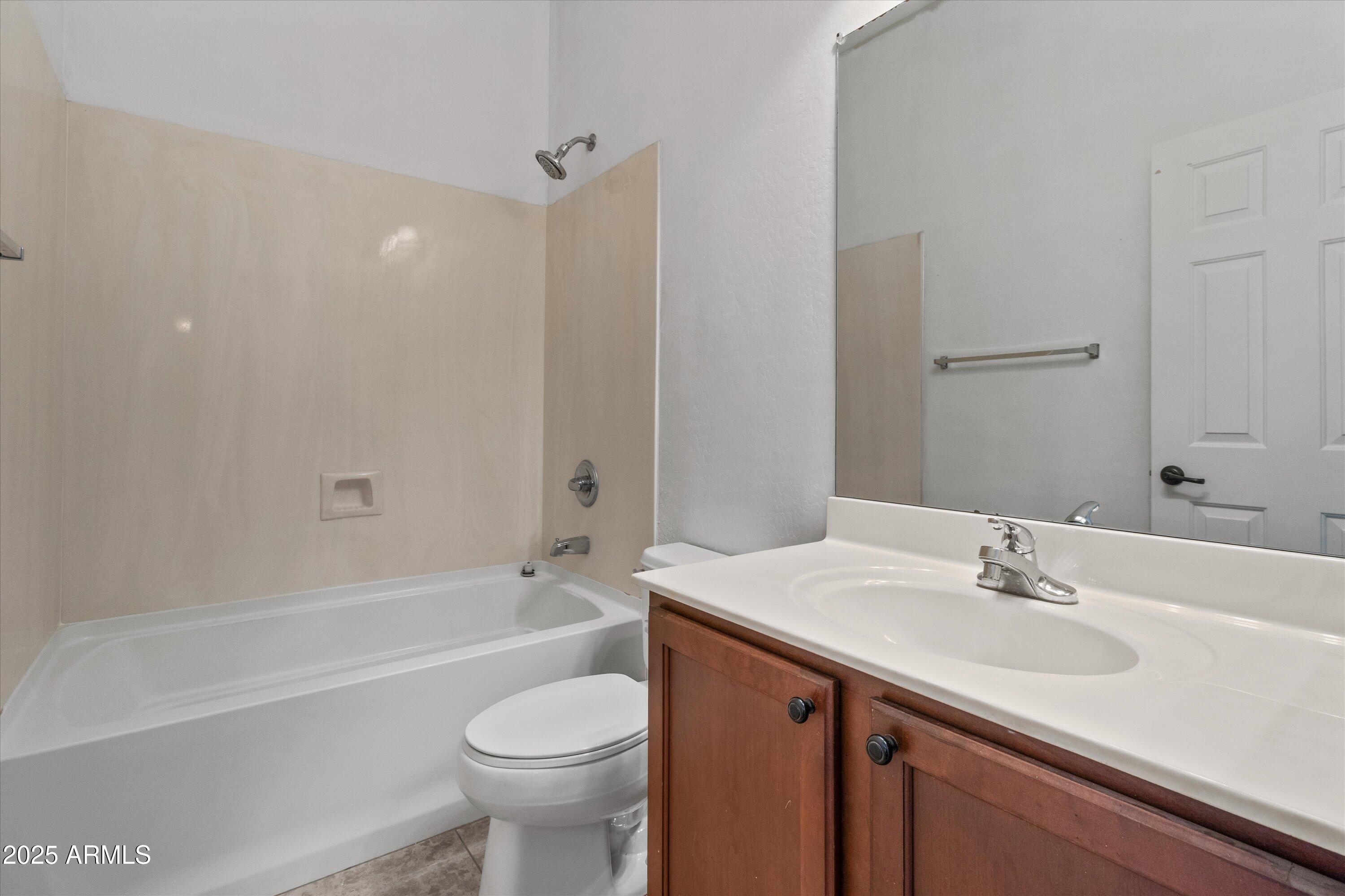 45076 West Rhea Road Maricopa, AZ 85139 - Photo 29 of 43 a bathroom with a sink a toilet and shower