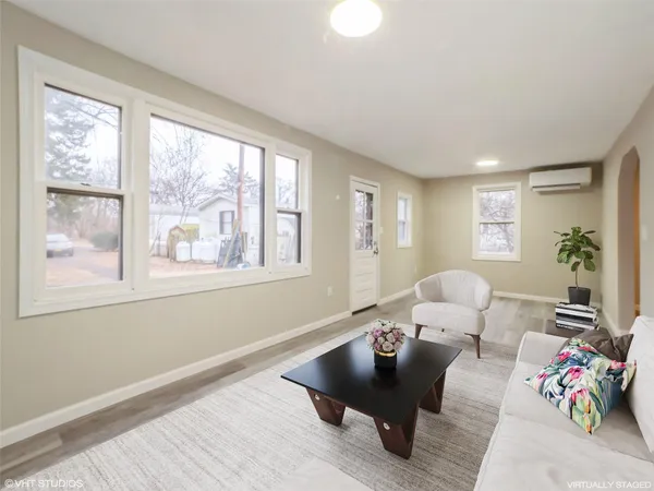 a living room with furniture and a window