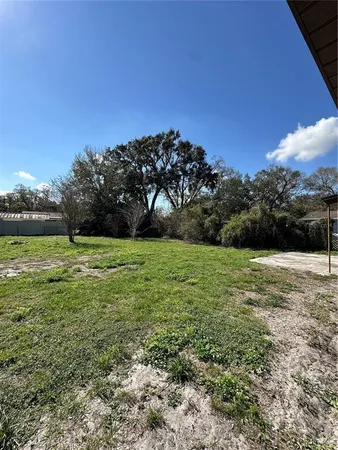 a view of a field with a big yard