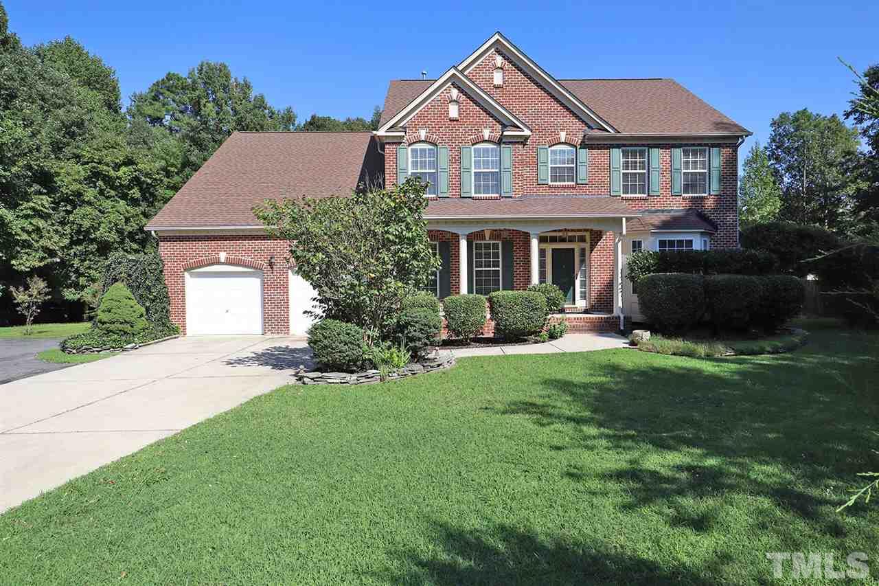 3233 Forestville Road Raleigh, NC 27616 - Photo 1 of 25 a front view of a house with a garden