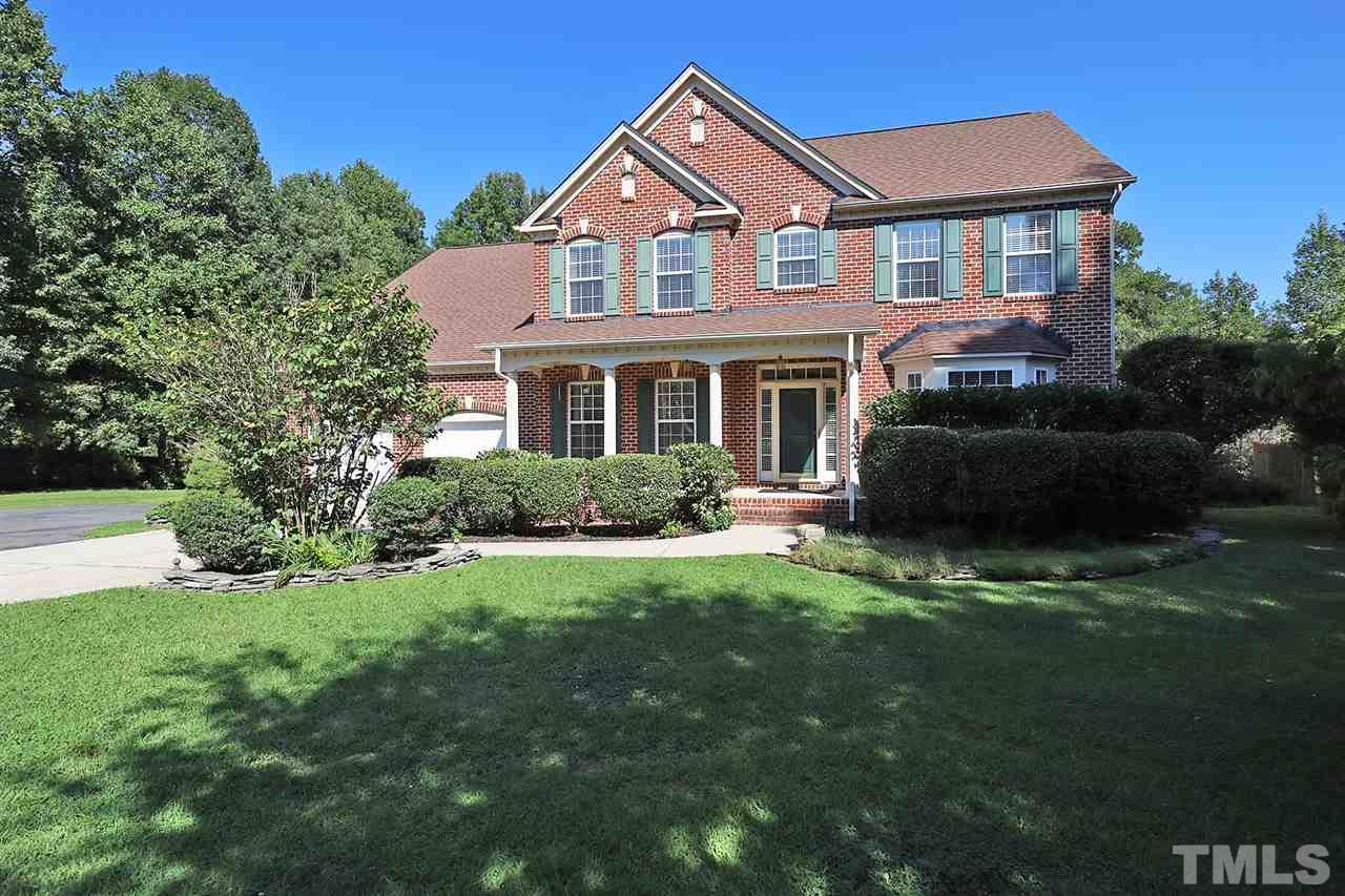 3233 Forestville Road Raleigh, NC 27616 - Photo 2 of 25 a front view of a house with a yard and potted plants