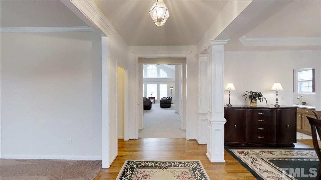 3233 Forestville Road Raleigh, NC 27616 - Photo 11 of 25 a view of a hallway to a livingroom with furniture