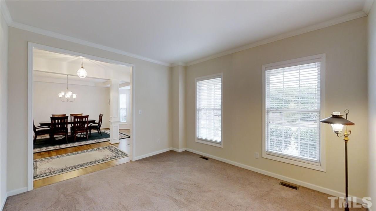 3233 Forestville Road Raleigh, NC 27616 - Photo 12 of 25 a view of a livingroom with workspace and a window