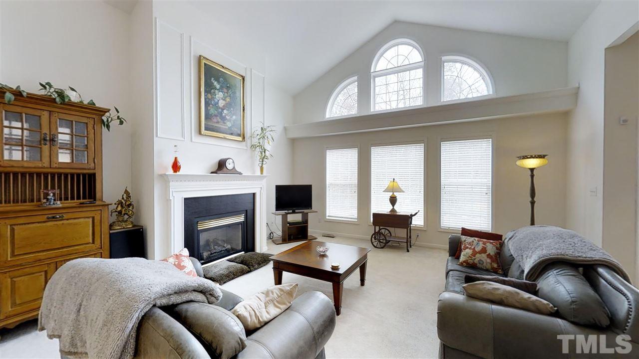 3233 Forestville Road Raleigh, NC 27616 - Photo 14 of 25 a living room with furniture fireplace and flat screen tv
