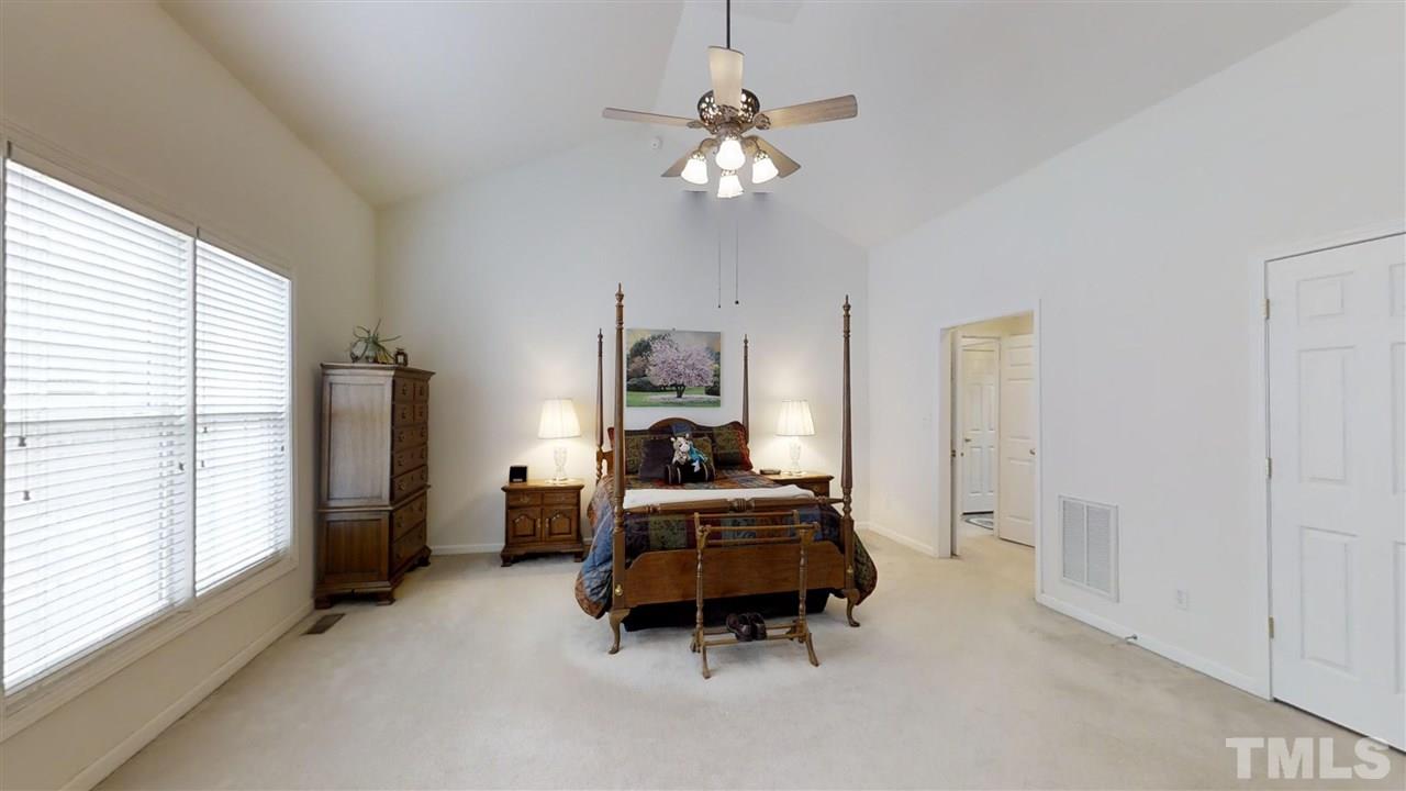 3233 Forestville Road Raleigh, NC 27616 - Photo 20 of 25 a living room with furniture and a chandelier