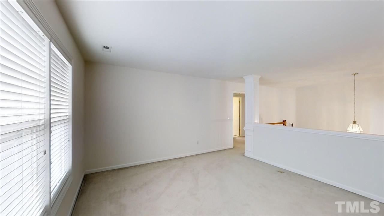 3233 Forestville Road Raleigh, NC 27616 - Photo 23 of 25 a view of an empty room and a window