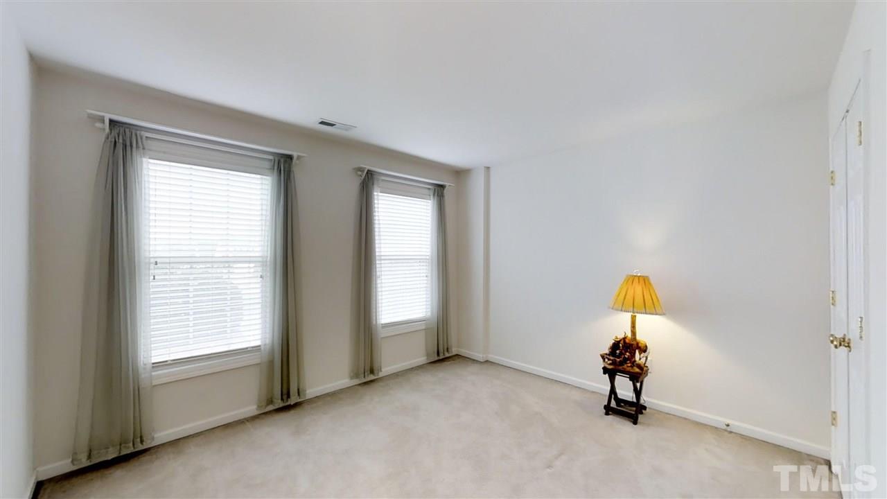 3233 Forestville Road Raleigh, NC 27616 - Photo 25 of 25 an empty room with windows