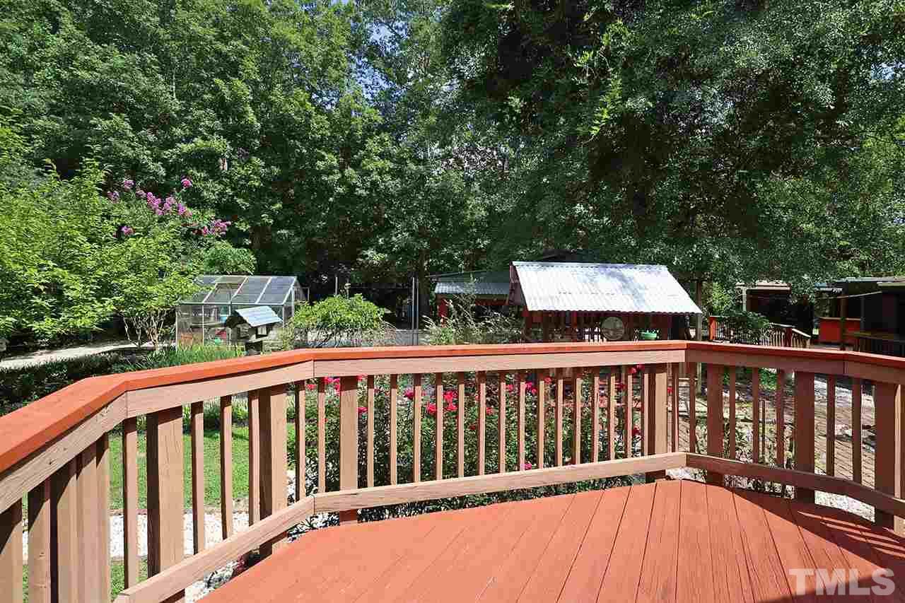 3233 Forestville Road Raleigh, NC 27616 - Photo 5 of 25 a balcony with trees in the back