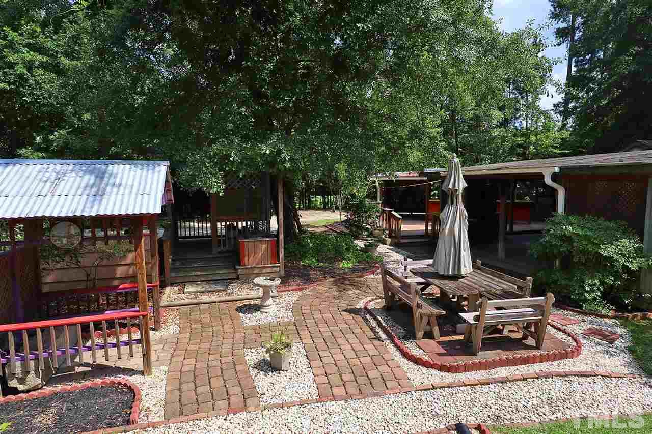 3233 Forestville Road Raleigh, NC 27616 - Photo 6 of 25 a view of a chairs and table in the patio