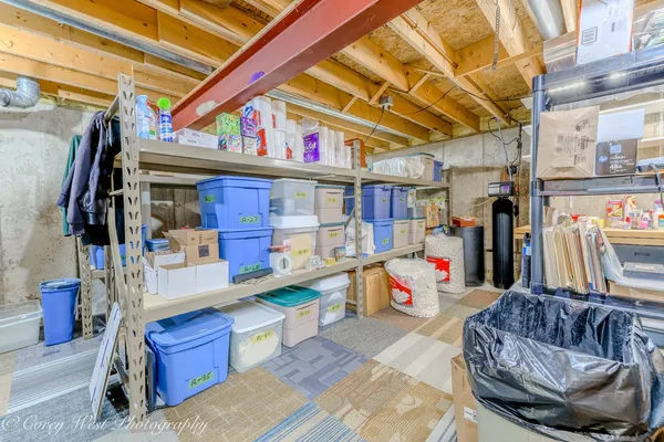 a living room with furniture and a book shelf
