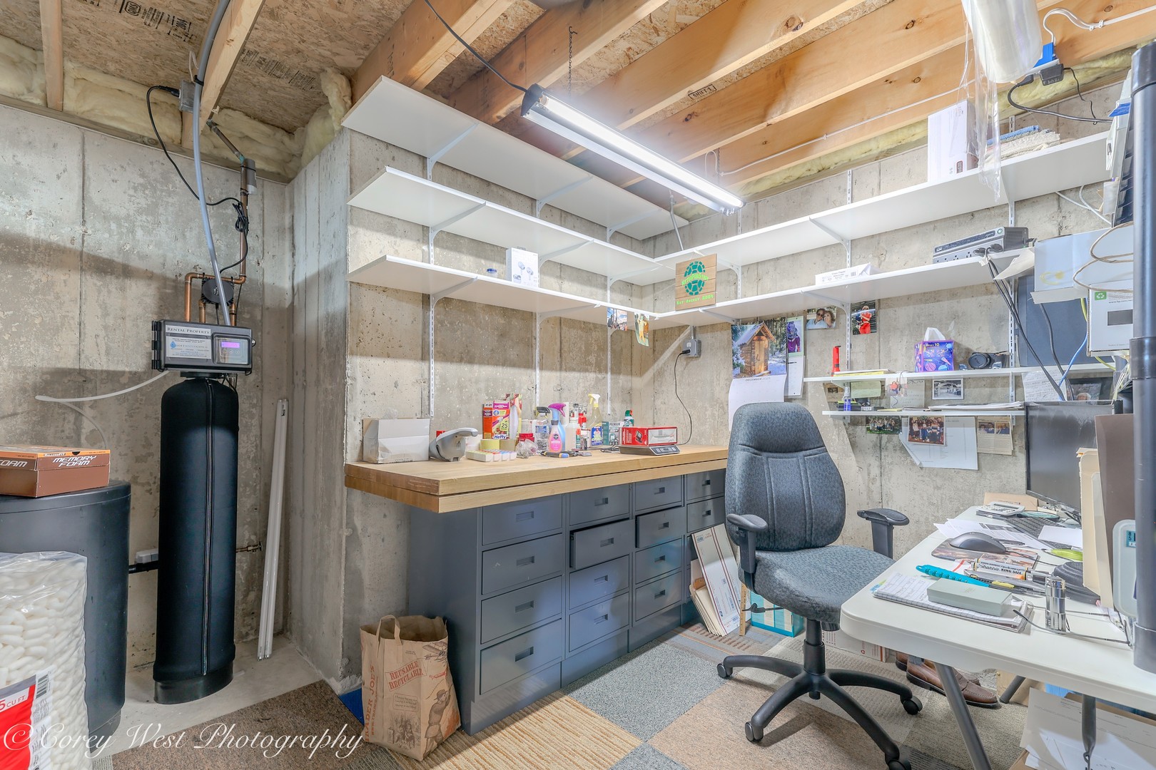 708 Nancy Court Sycamore, IL 60178 - Photo 24 of 29 a room with lots of wooden furniture and a chandelier