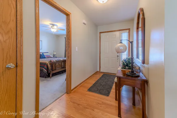 a bedroom with furniture and a mirror