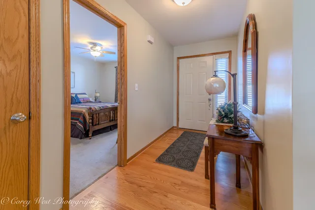 a bedroom with furniture and a mirror