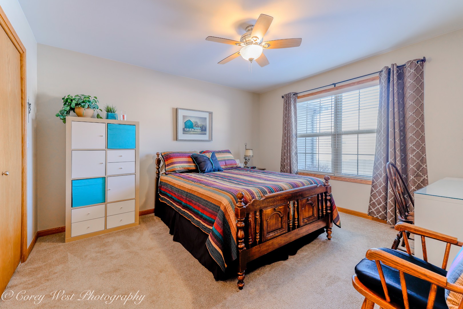 708 Nancy Court Sycamore, IL 60178 - Photo 4 of 29 a bed room with a bed and a chandelier