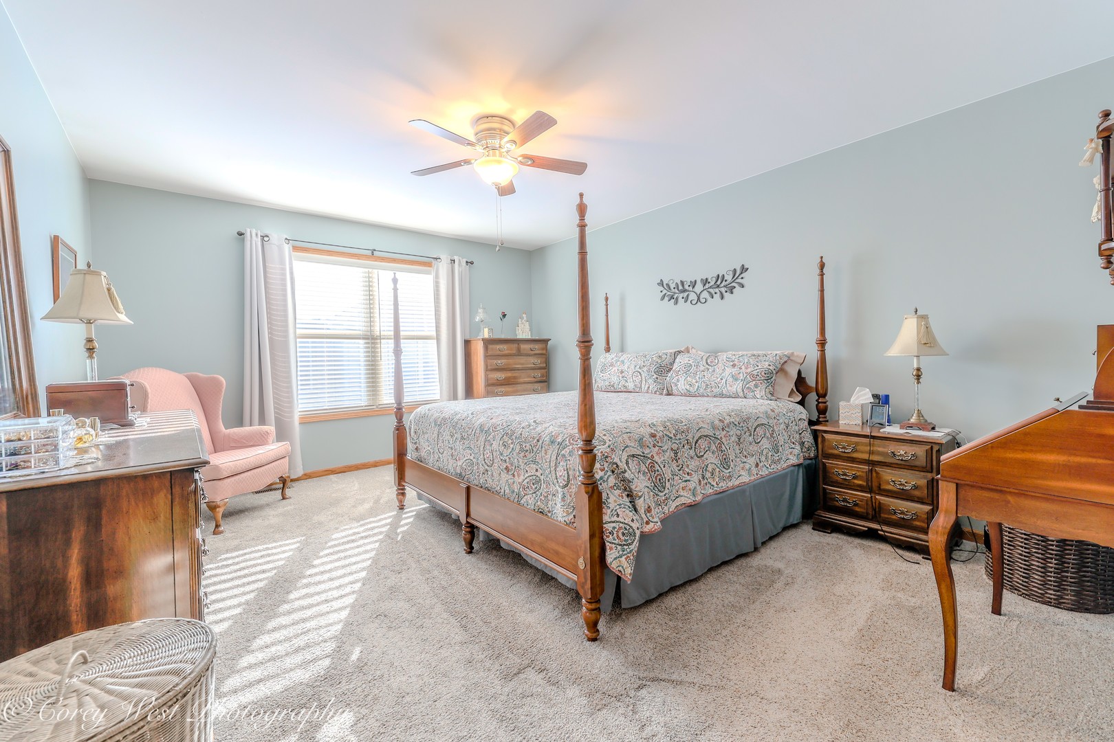 708 Nancy Court Sycamore, IL 60178 - Photo 7 of 29 a bedroom with a bed and a chandelier