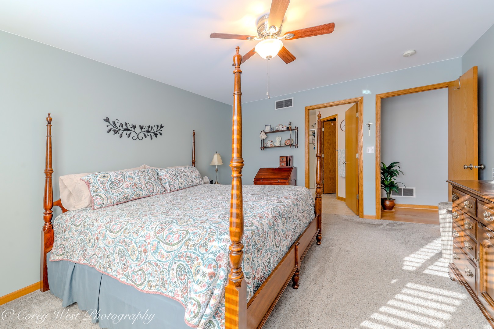 708 Nancy Court Sycamore, IL 60178 - Photo 8 of 29 a bedroom with a large bed and a chandelier