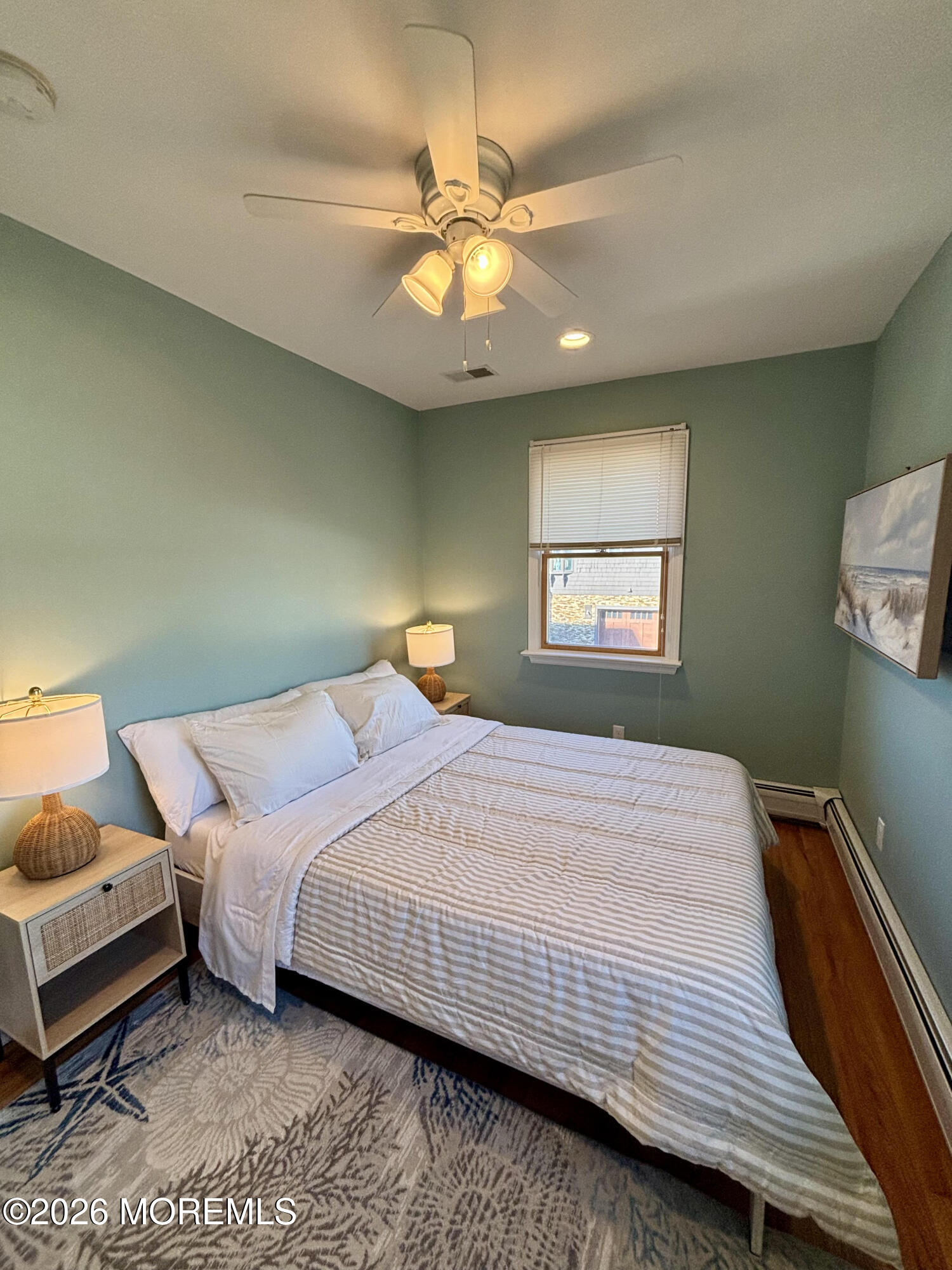 1 Beach Way, Unit A Sea Bright, NJ 07760 - Photo 11 of 13 a bedroom with a bed and a chandelier