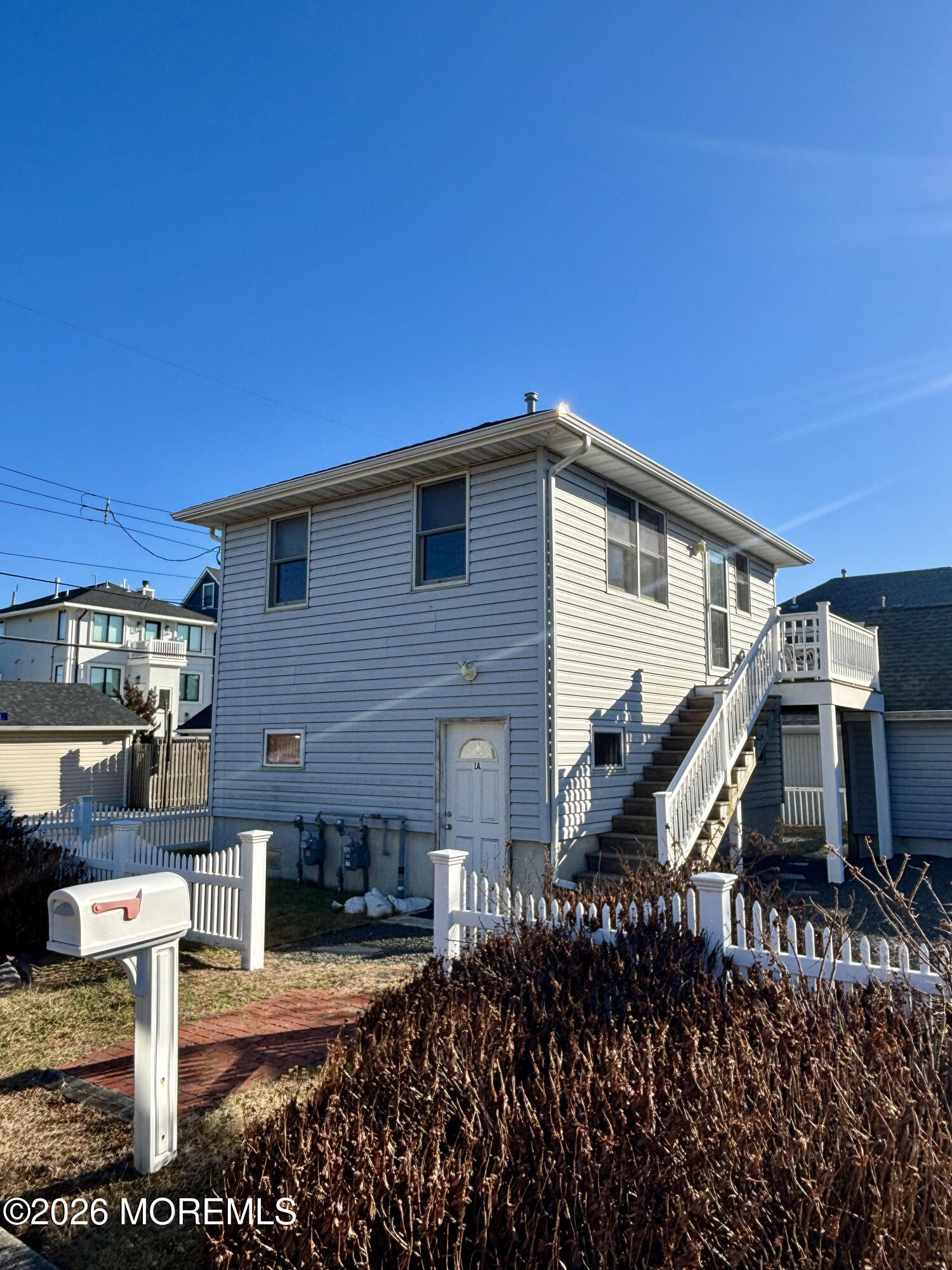 1 Beach Way, Unit A Sea Bright, NJ 07760 - Photo 12 of 13 a front view of a house with a yard
