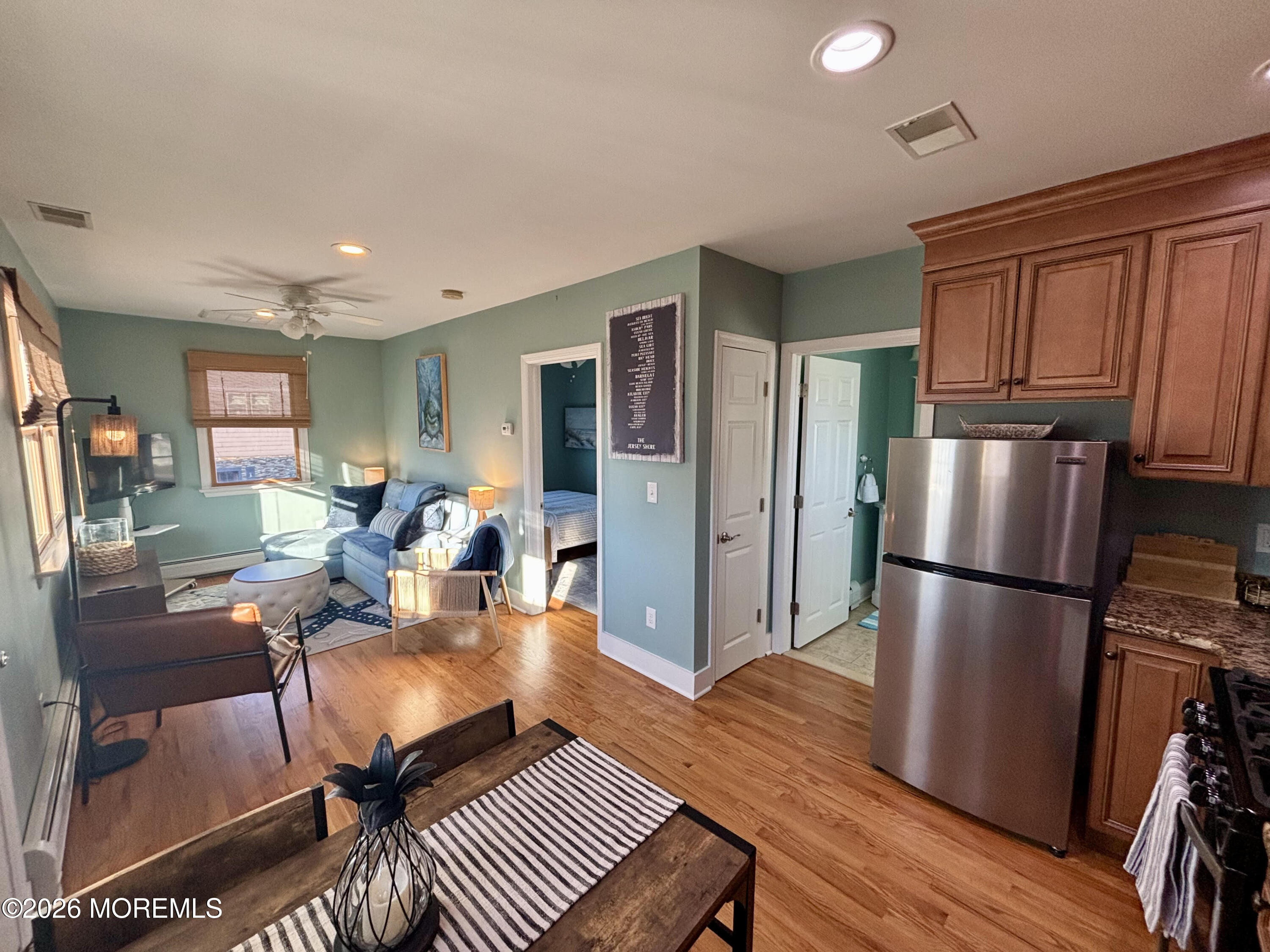 1 Beach Way, Unit A Sea Bright, NJ 07760 - Photo 5 of 13 a living room with furniture wooden floor and a refrigerator