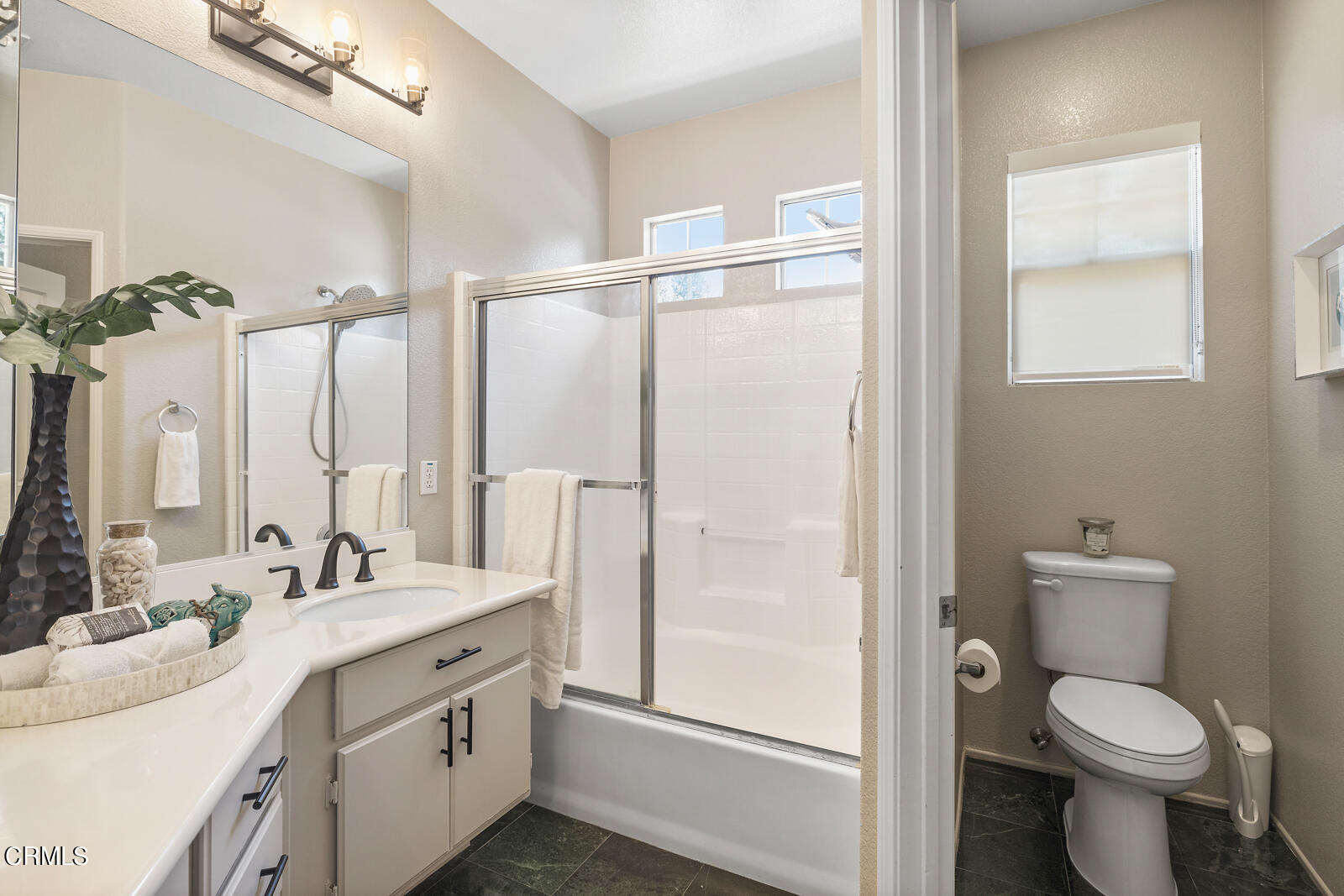 1118 Rosewalk Way Pasadena, CA 91103 - Photo 13 of 19 a bathroom with a double vanity sink toilet and shower