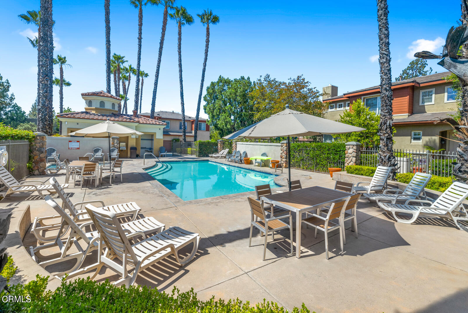 1118 Rosewalk Way Pasadena, CA 91103 - Photo 19 of 19 a patio with a table and chairs under an umbrella