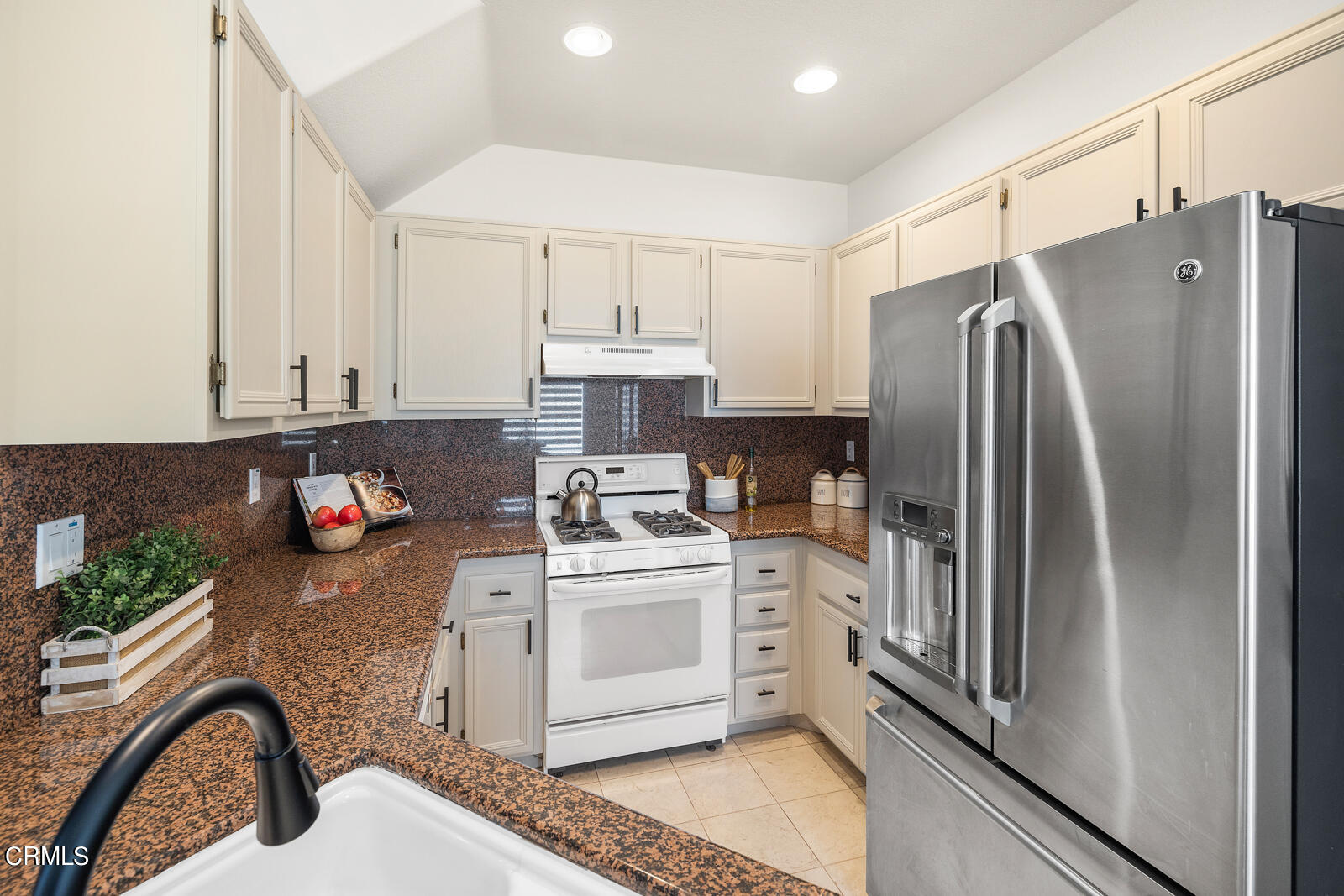 1118 Rosewalk Way Pasadena, CA 91103 - Photo 6 of 19 a kitchen with stainless steel appliances a refrigerator sink and white cabinets