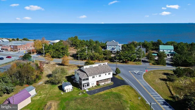 a view of a swimming pool with lawn chairs